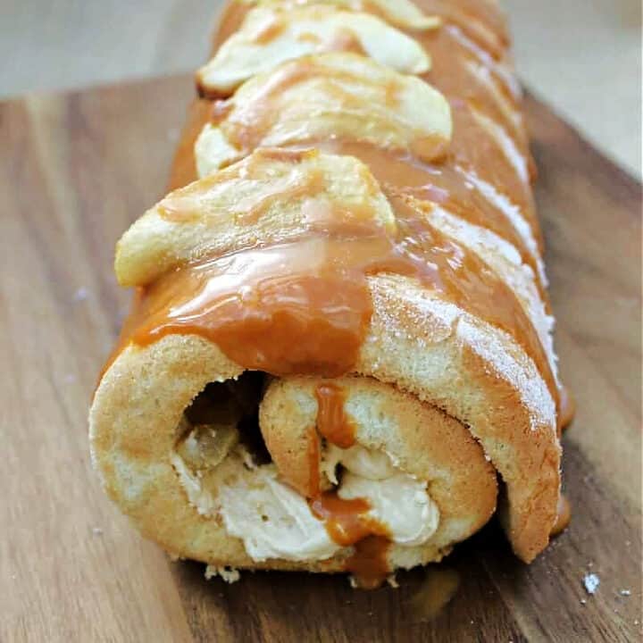Close up of cake roll with caramel drip.