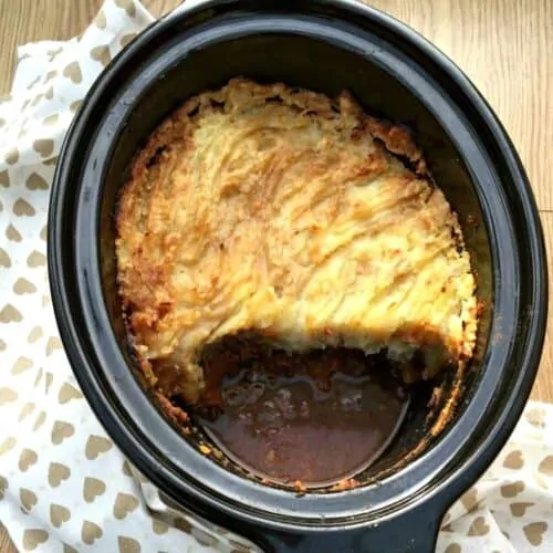 Cottage pie with mash in slow cooker pot.