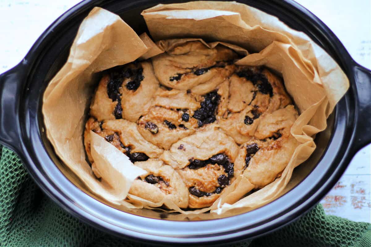 Mincemeat-filled rolls after baking in slow cooker pot.