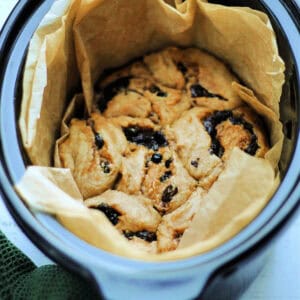 Mincemeat swirls in slow cooker pot lined with baking paper.