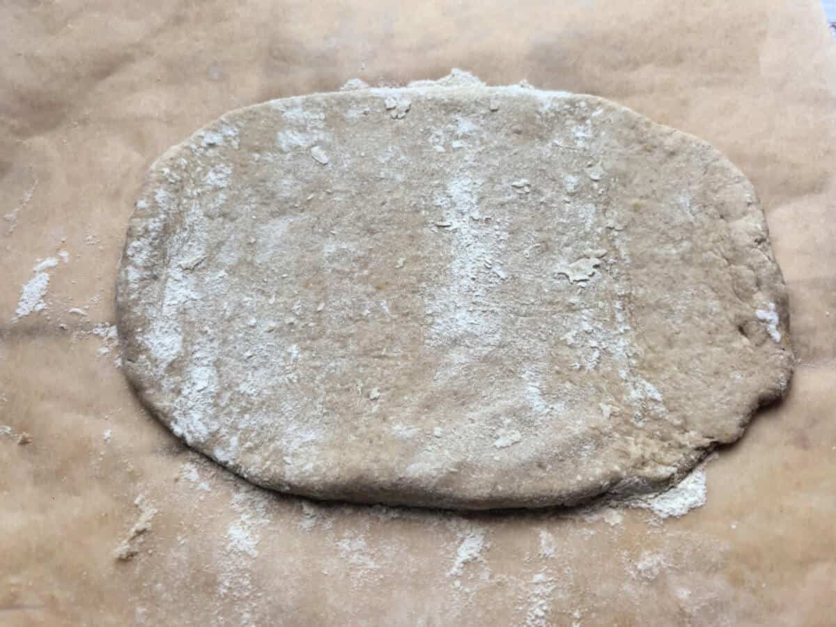 Rolled out dough on baking paper.