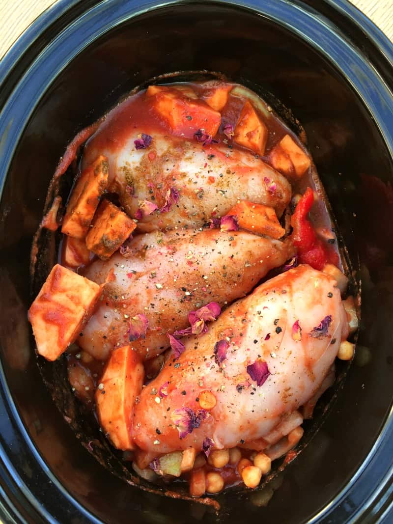 Ingredients for chicken tagine in slow cooker pot.