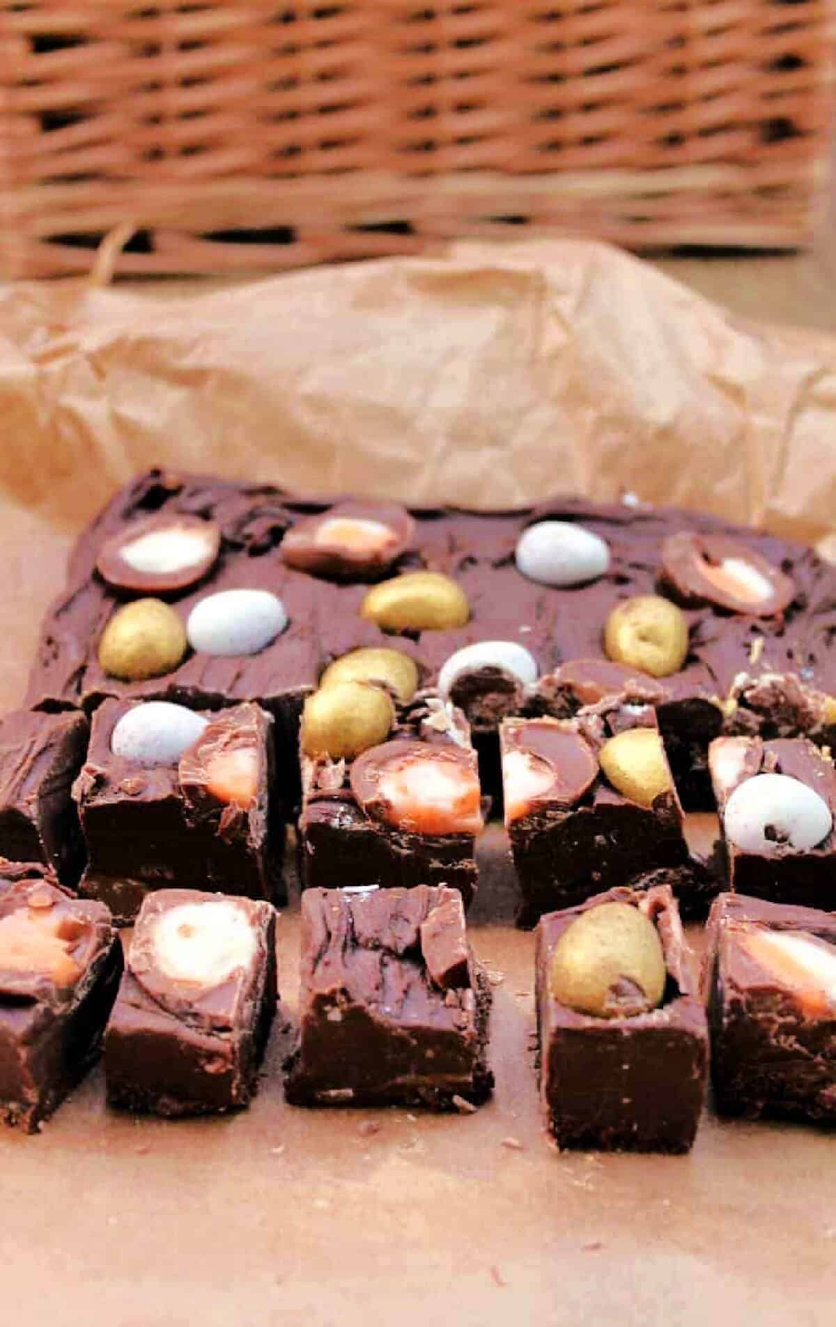 Slab of fudge topped with mini Creme Eggs and mini eggs.