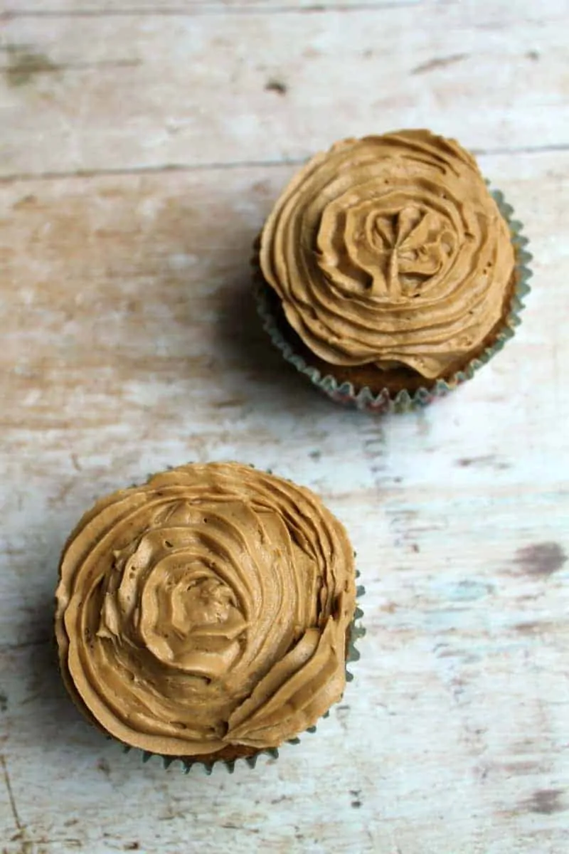 View from above of two iced cupcakes, showing the textured coffee icing.