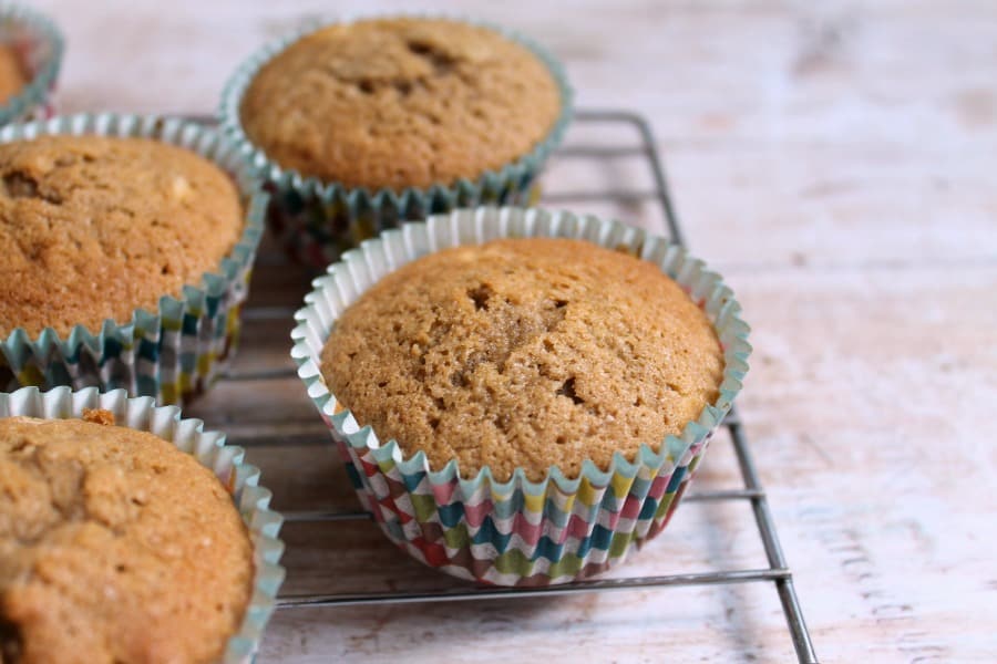 Cupcakes on a cooling rack, before icing.