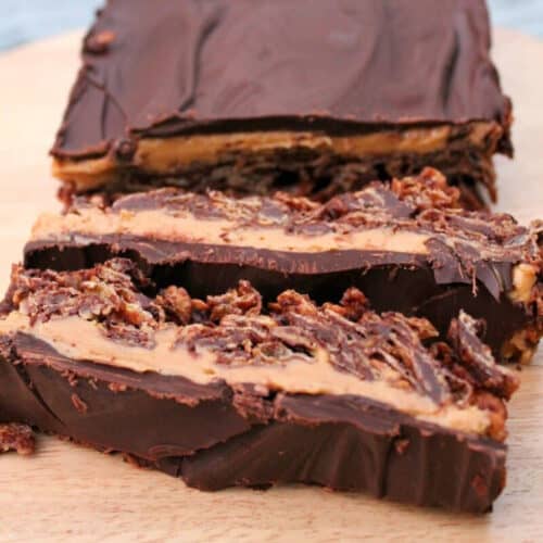 Chocolate peanut butter cornflake slice sliced open.