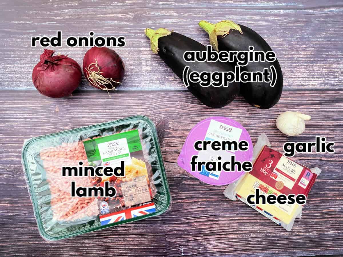 Fresh ingredients for making moussaka, labelled;