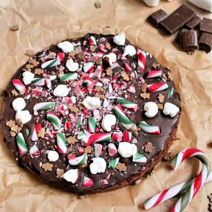 Chocolate shortbread covered with chocolate and decorated with Christmas treats.