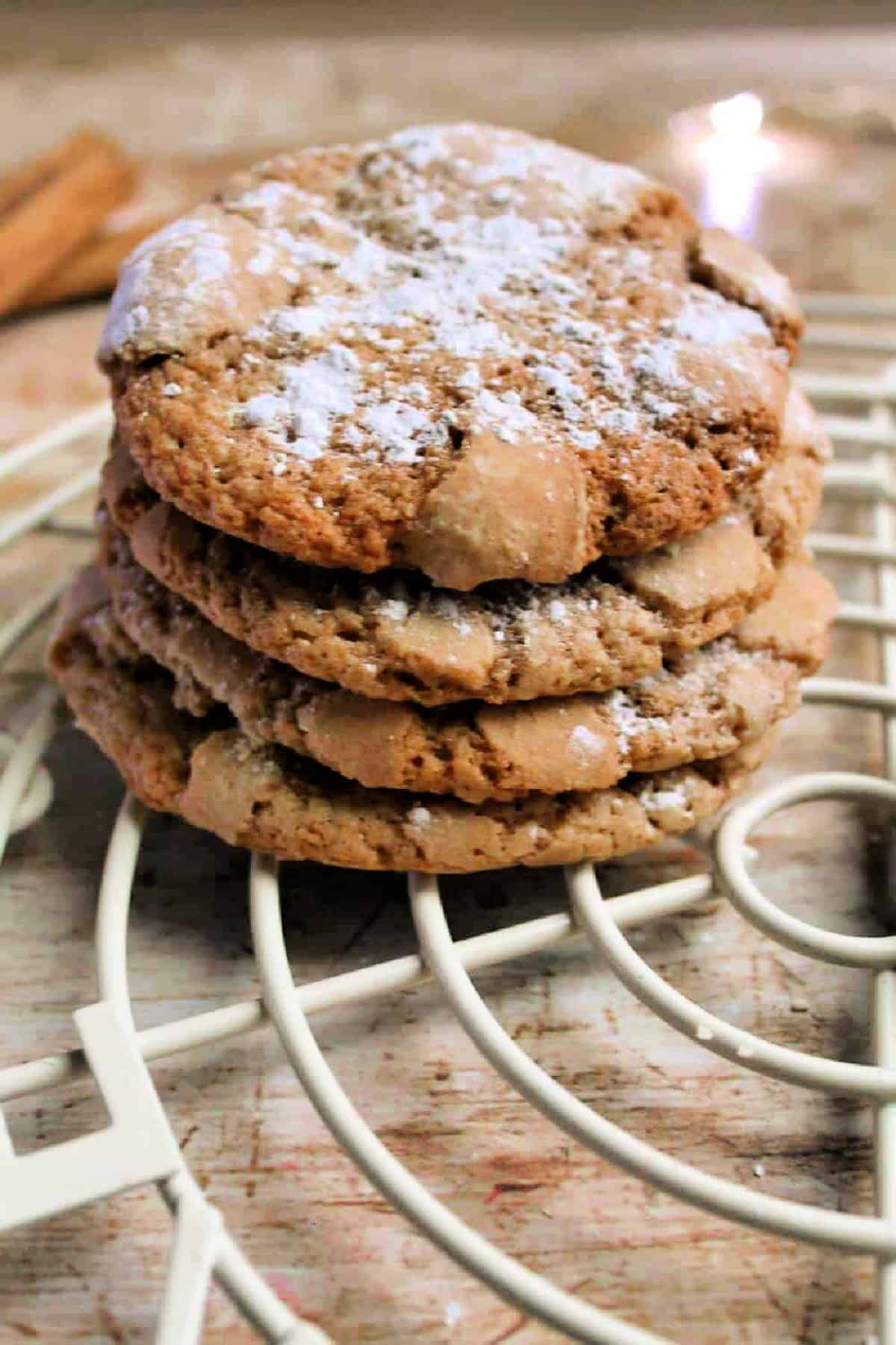 A stack of cookies with powdered sugar dusted on top.