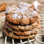 A stack of cookies with powdered sugar dusted on top.
