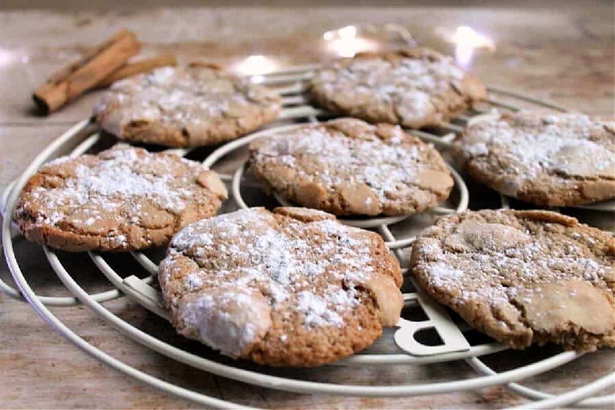 cookies on a cooling rack, fairy lights in background.