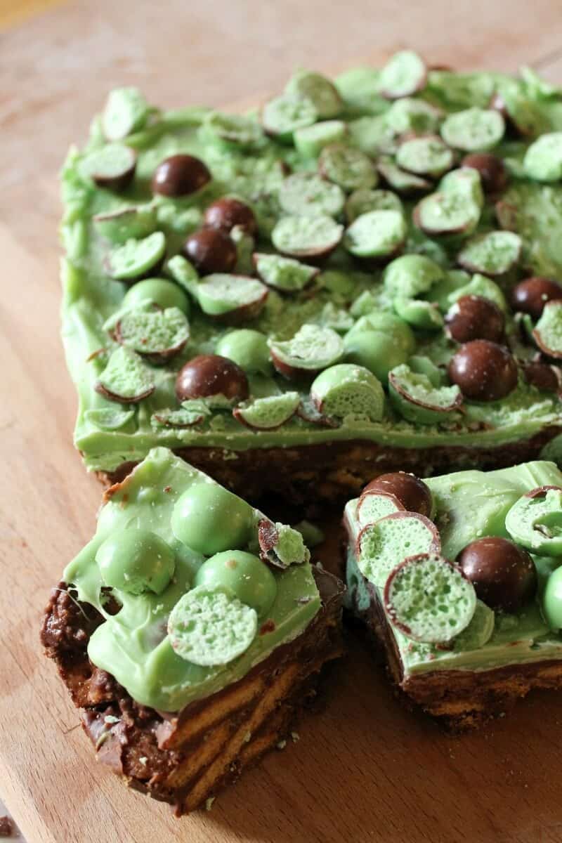 Mint Aero Chocolate Fridge Cake, vertical shot, sliced on a wooden board