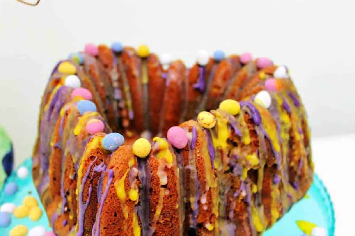 Side view of heart bundt cake with mini eggs.
