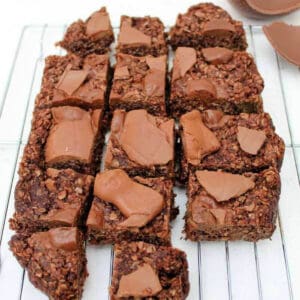 Chocolate flapjacks on a cooling rack.