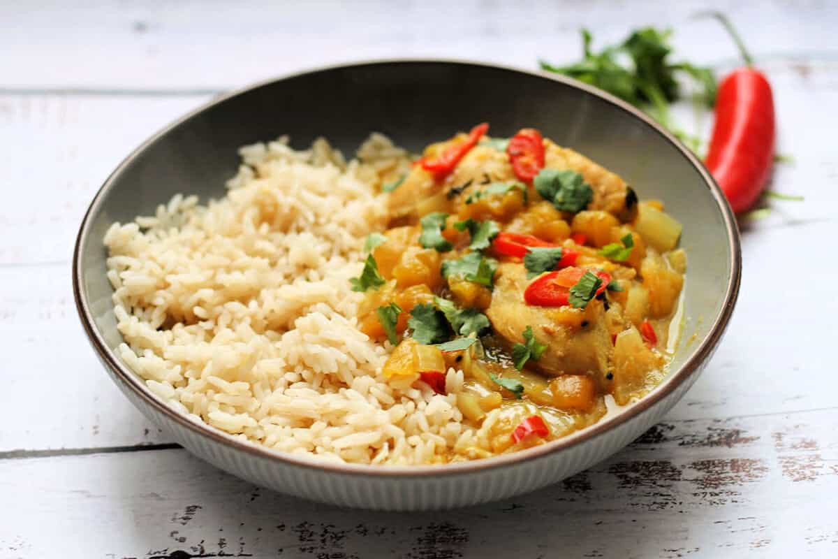 Bowl of mango chicken and rice.