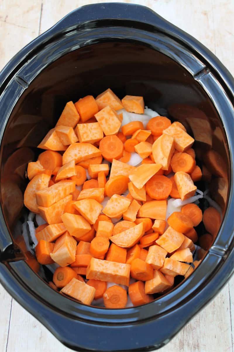 Slow cooker chicken casserole - sweet potatoes and vegetables in the base of the pot