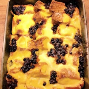 Close up of bread and butter pudding made with custard and mincemeat.