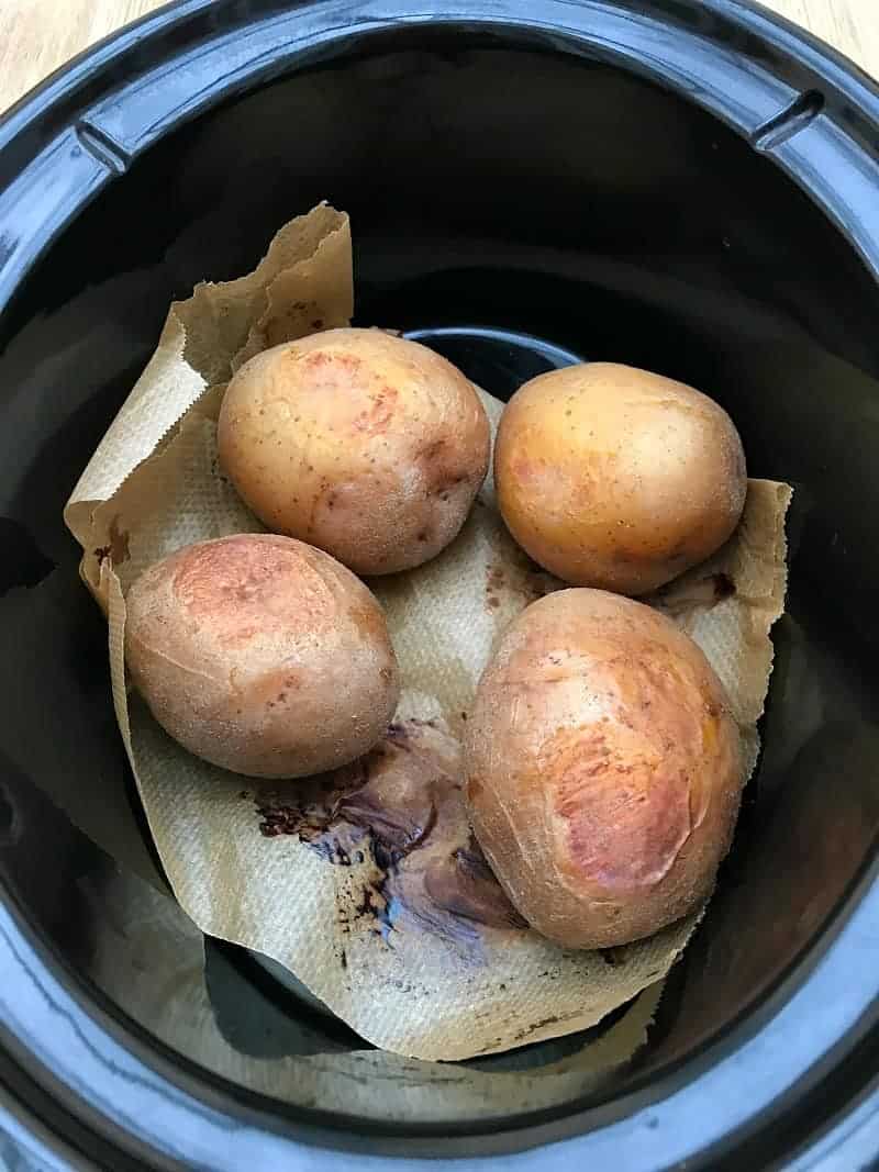 Baking a batch of baked potatoes in the slow cooker