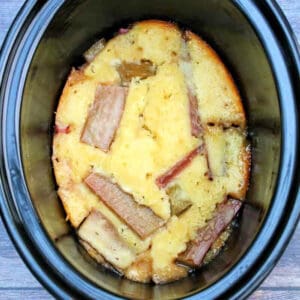 Rhubarb cobbler in slow cooker pot.