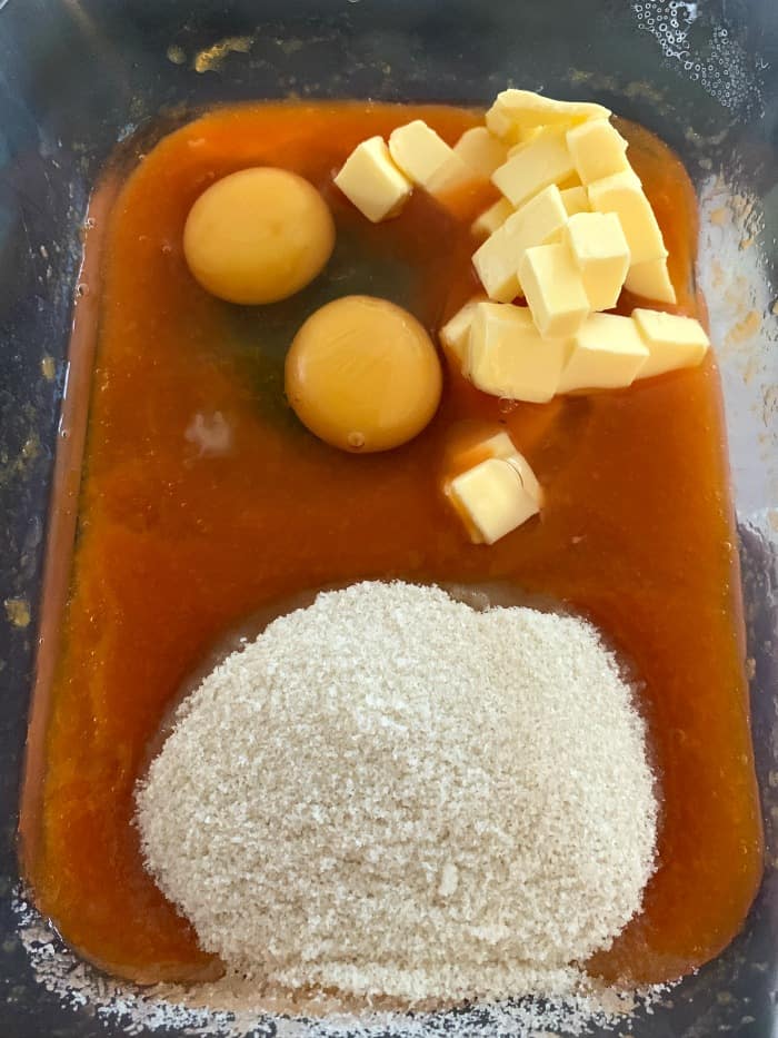 Ingredients in a tub - butter, eggs, sugar and apricot juice/puree.