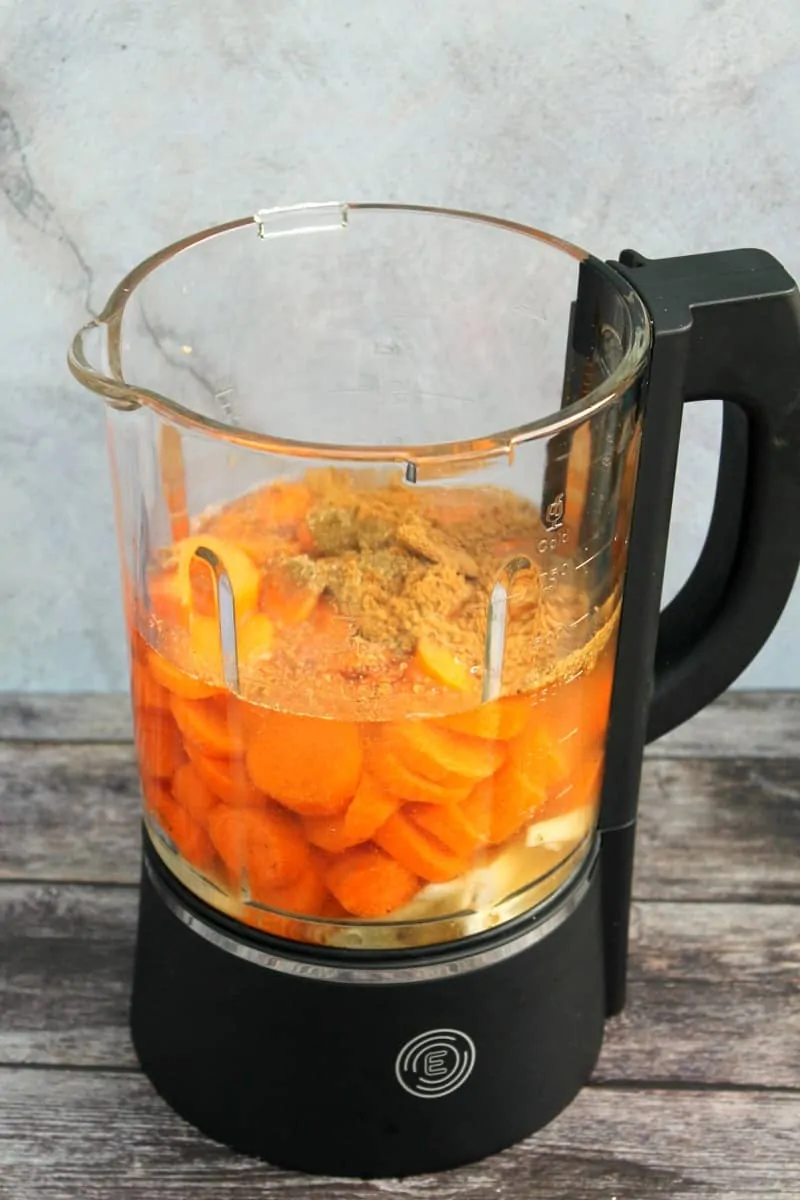 Blender jug with soup ingredients.