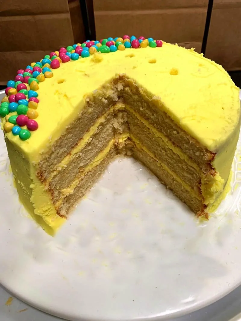Birthday cake cut open to those the three layers inside.