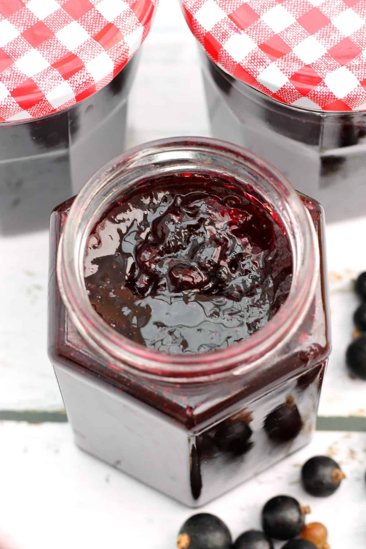 Overhead view of an open jar of jam.