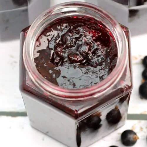 Close up of blackcurrant jam in the jar, from above.