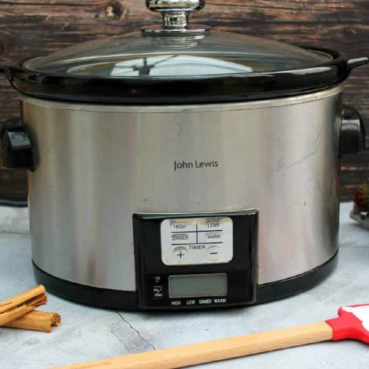 A silver digital slow cooker, in close up.