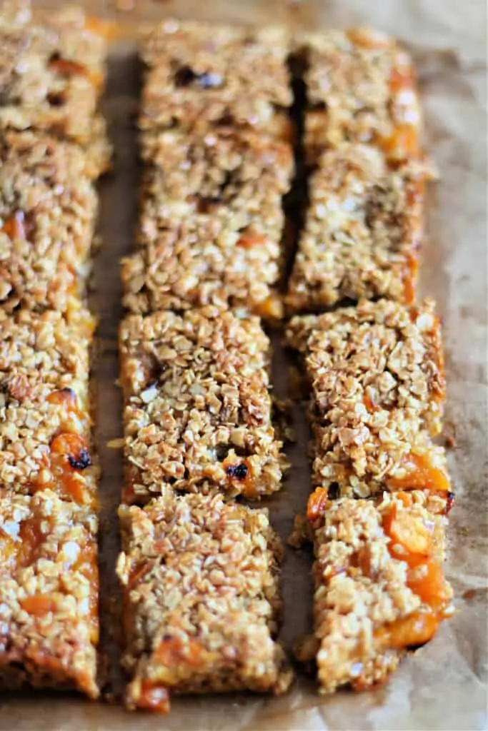 Flapjack slab with apricots scored into pieces.