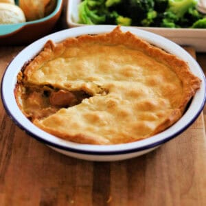 Chicken pot pie in a white pie dish.