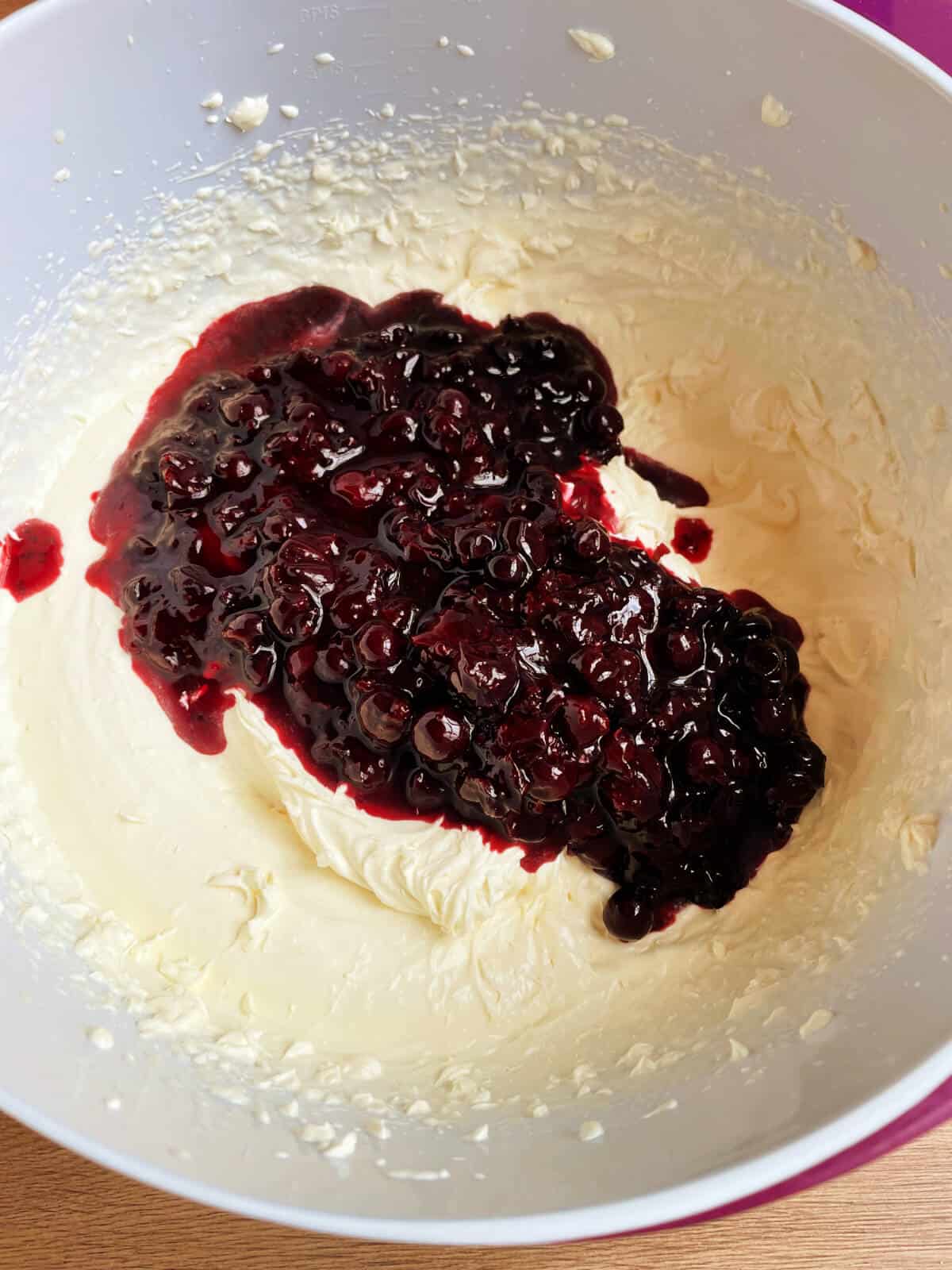 Blackcurrant puree added into whipped double cream.