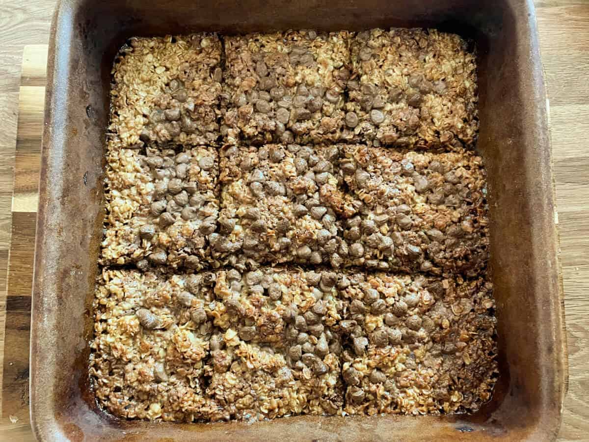 Scored flapjacks after baking, in tray.