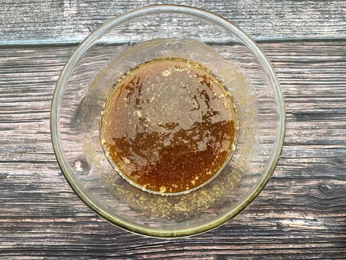 Melted butter, golden syrup and brown sugar in a glass bowl.