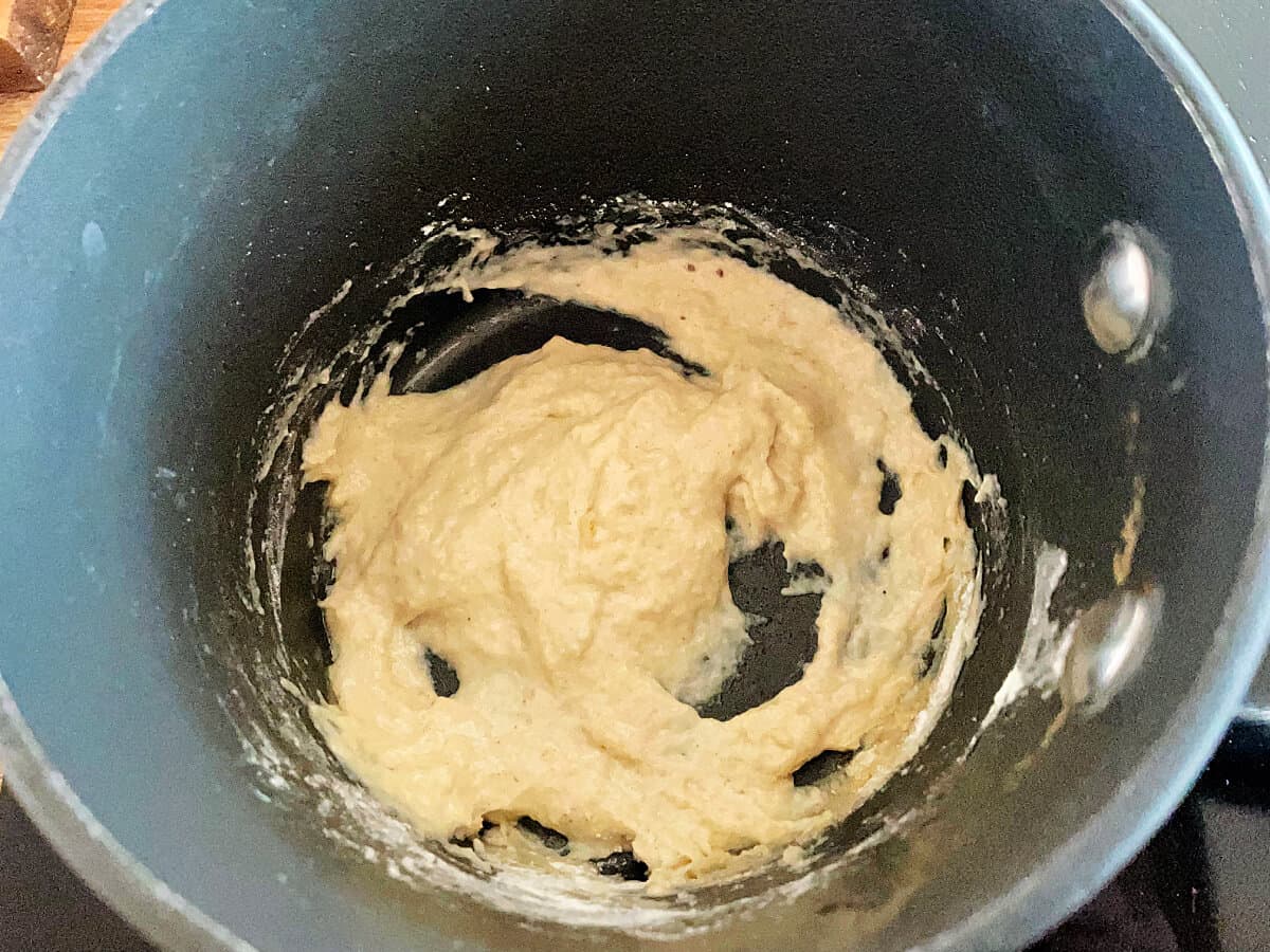
A roux mixture in a small saucepan.