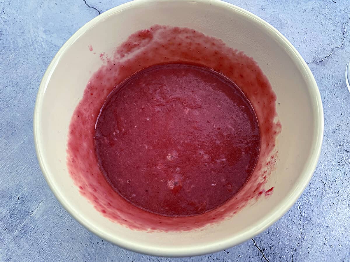 Bowl of cranberry curd, after part cooking.