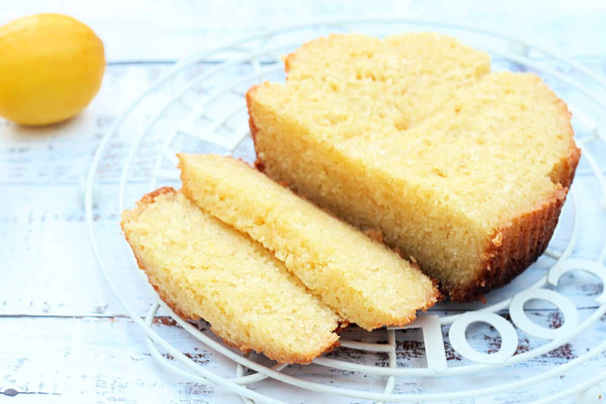 A sliced cake on a cooling rack.