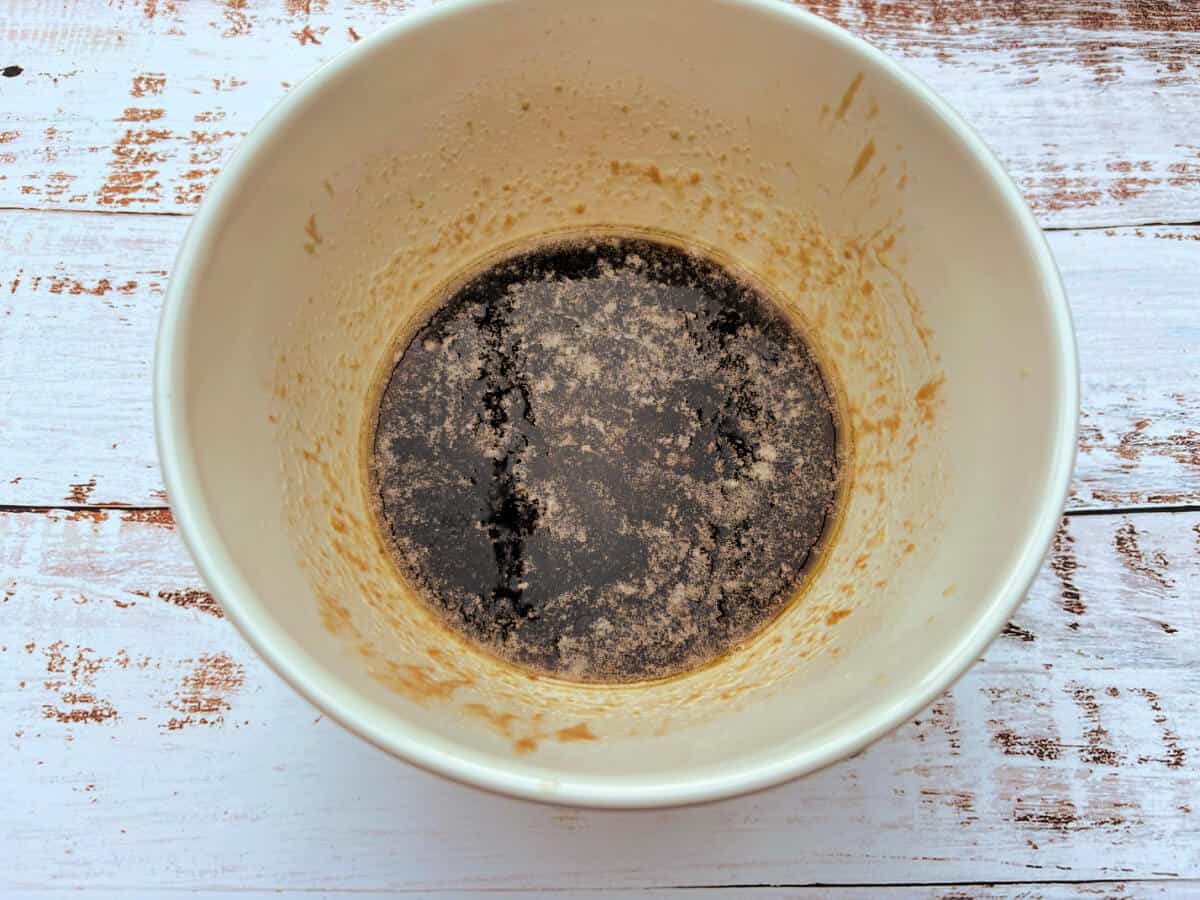 A bowl containing melted sugar, golden syrup and butter.