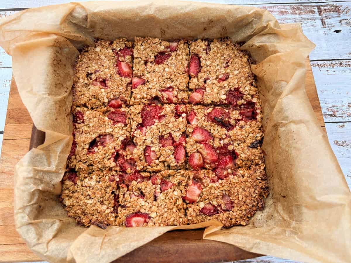 A square of flapjacks with strawberries.