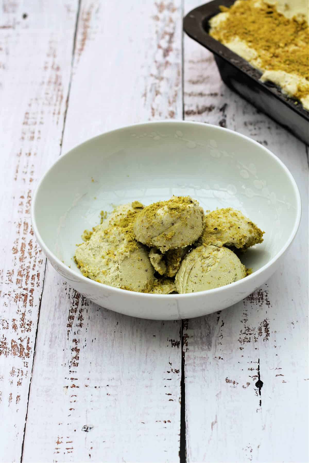 Ice cream in a white bowl.
