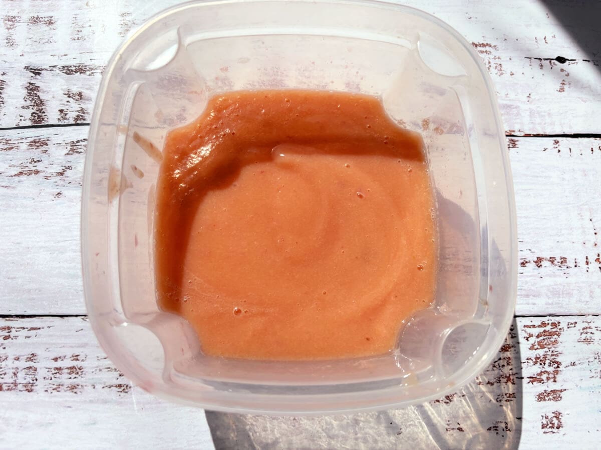 Peach puree in a tub.