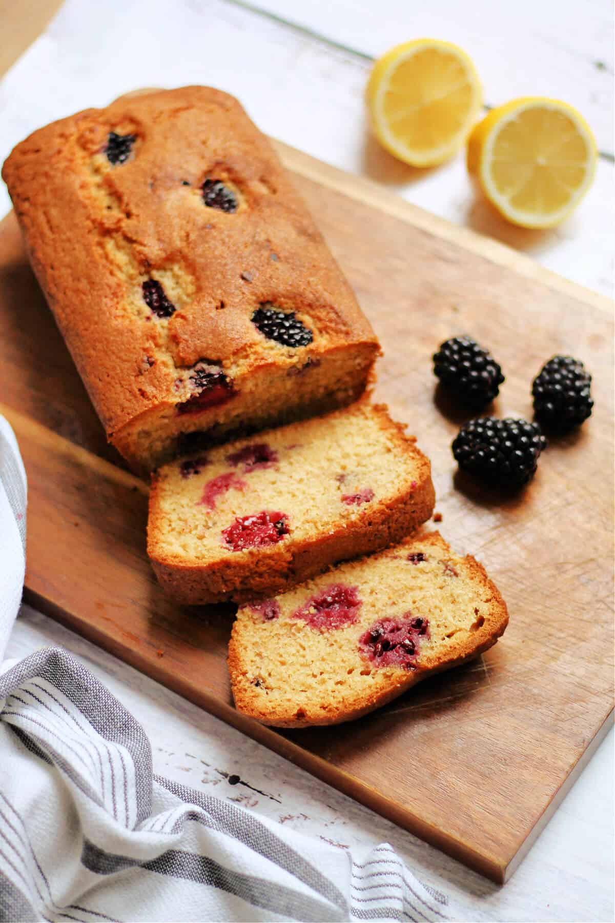 Top view of sliced cake on chopping board.