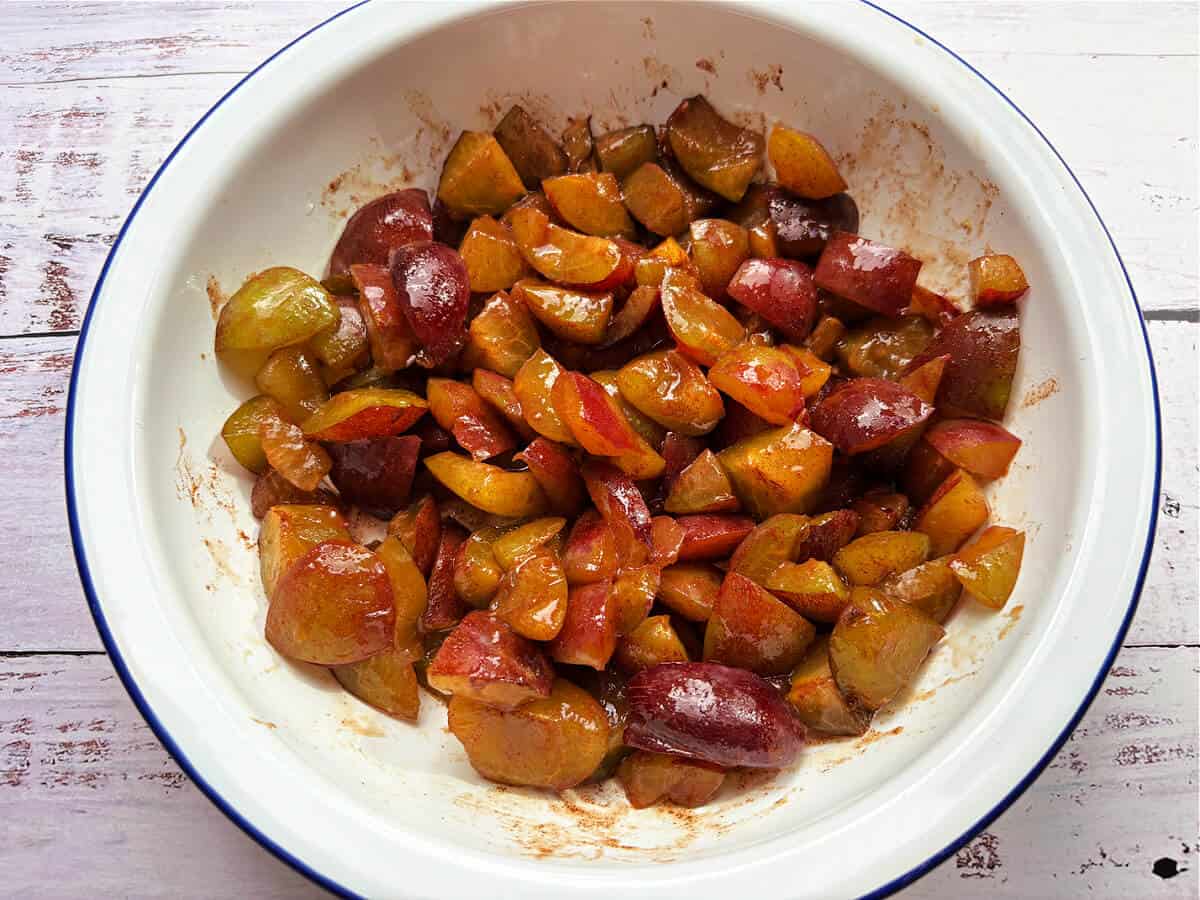 Plum filling in pie dish.
