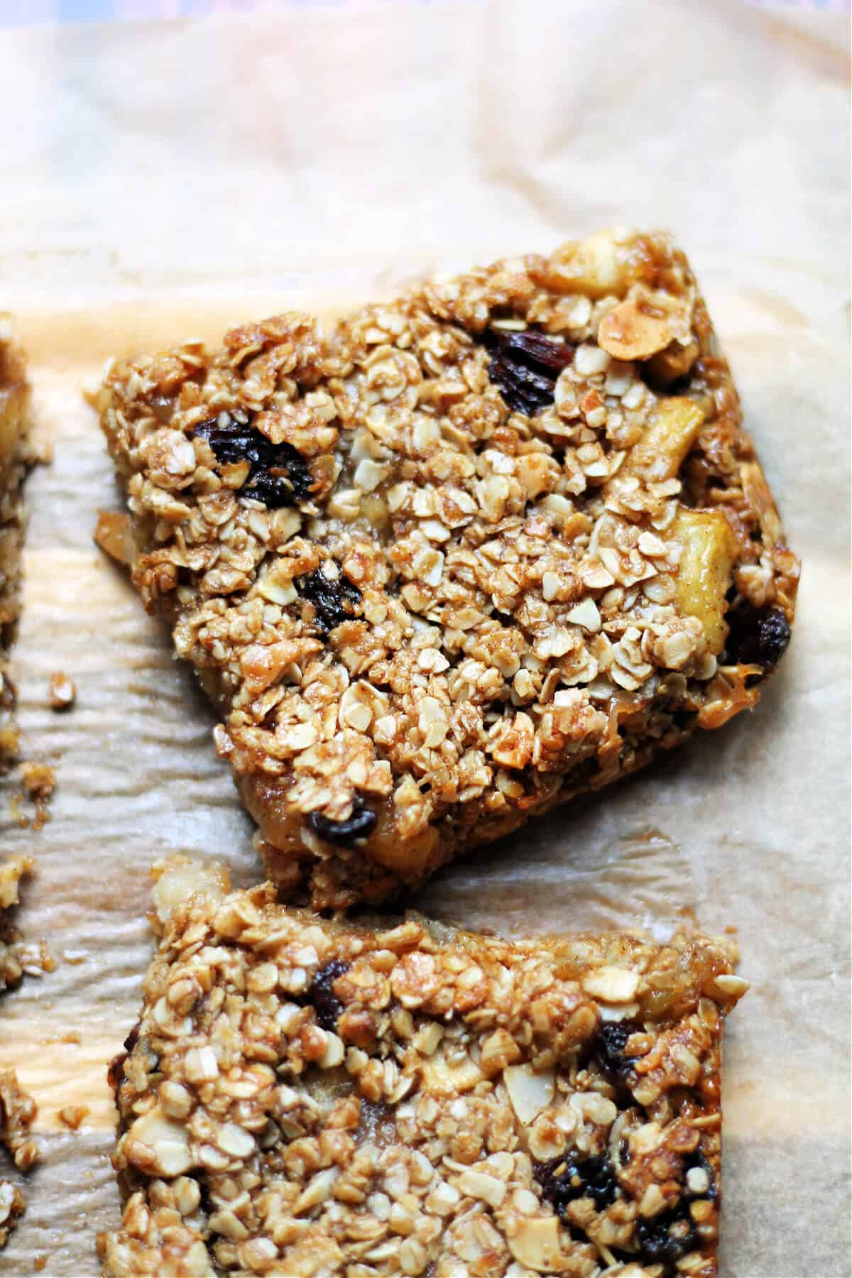 Squares of flapjack with gooey apple, sultanas and flaked almonds.