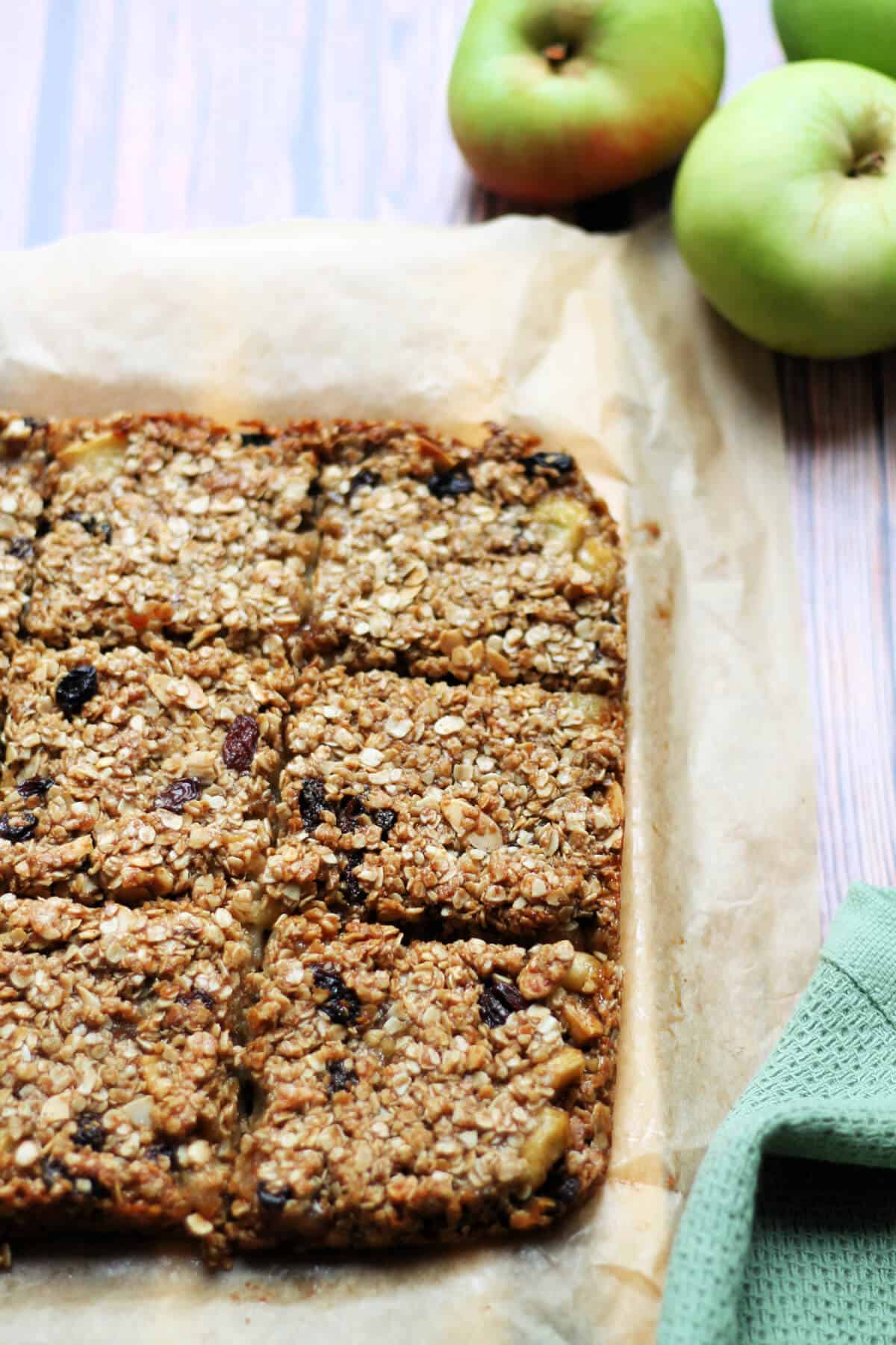 Squares of flapjack on a wooden board.
