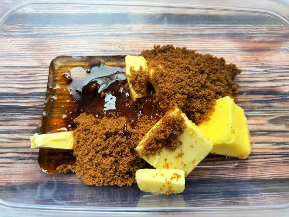 Butter, golden syrup and brown sugar in a bowl.