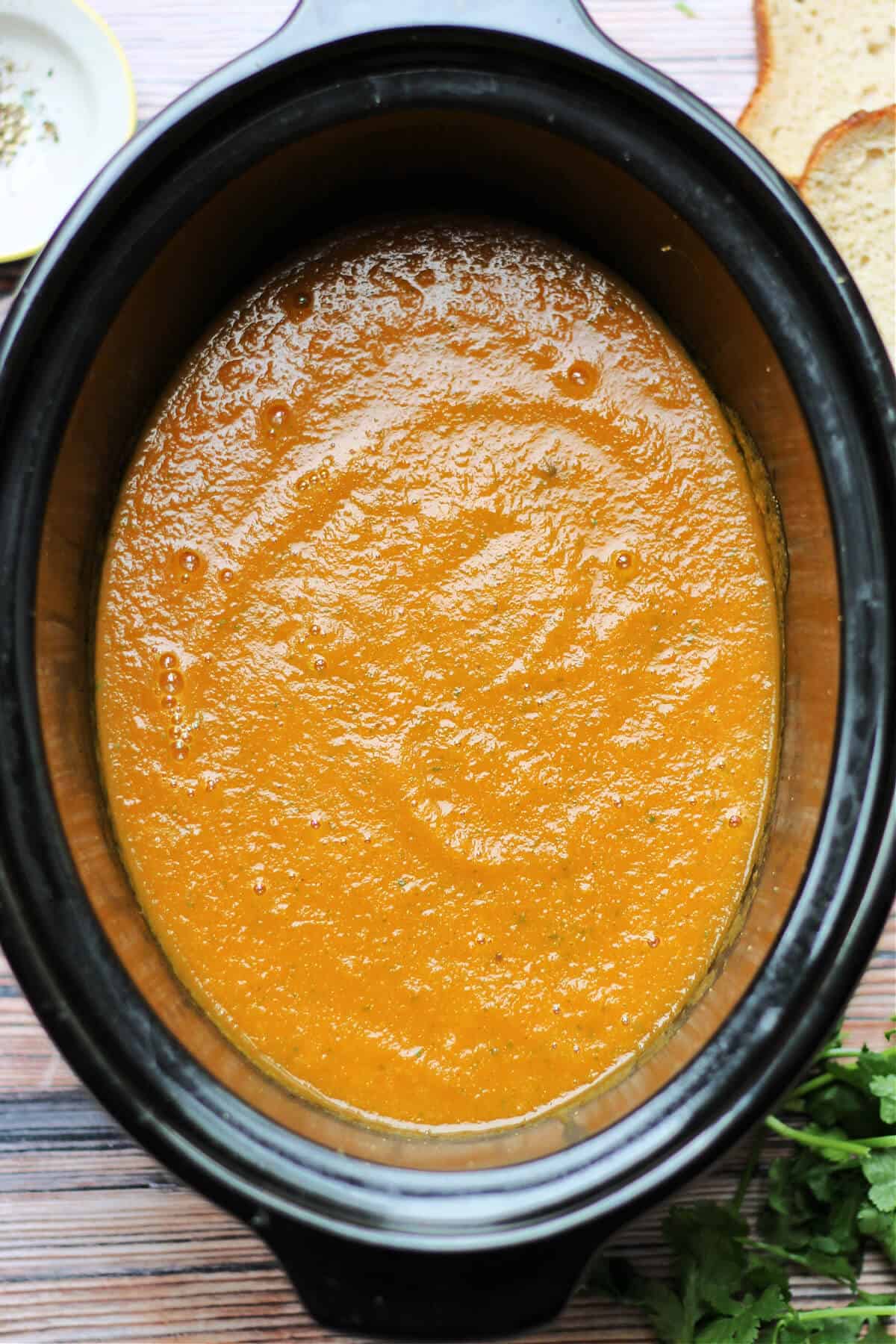 Soup in slow cooker pot.