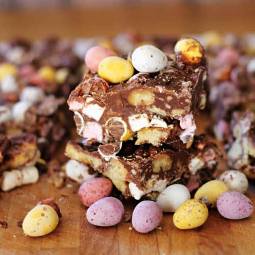 Two stacked pieces of colourful mini egg rocky road.