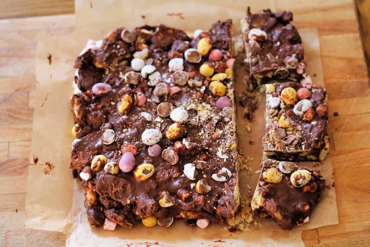 Rocky road on parchment, some squares cut out.