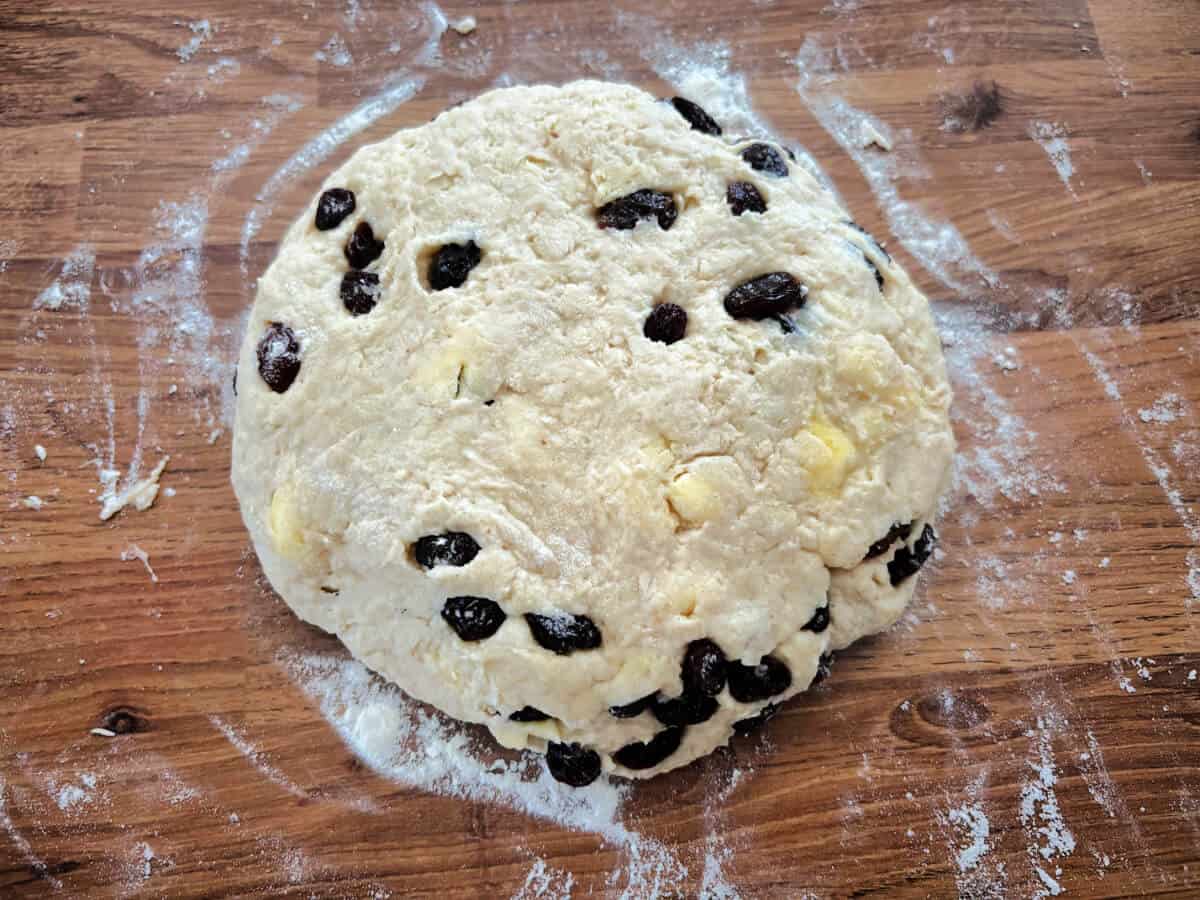 Scone dough rolled out into a flat circle.
